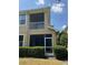 Exterior view of a screened patio on a multi-story home with a well-maintained lawn at 12631 Silverdale St, Tampa, FL 33626