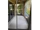 Relaxing screened patio with sliding glass doors and view of greenery at 12631 Silverdale St, Tampa, FL 33626
