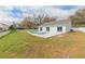 Expansive backyard featuring a swimming pool and patio, perfect for outdoor relaxation and entertainment at 12910 Longcrest Dr, Riverview, FL 33579
