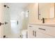 Modern bathroom with marble-look tile in shower, a glass door and matte-black fixtures at 12910 Longcrest Dr, Riverview, FL 33579