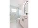 Bathroom featuring walk-in shower, white vanity, black hardware and fixtures at 12910 Longcrest Dr, Riverview, FL 33579