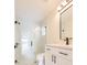 Sleek bathroom featuring marble-look tile, a glass-enclosed shower, & modern matte-black fixtures at 12910 Longcrest Dr, Riverview, FL 33579