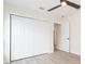 Bedroom features a ceiling fan, closet, and an open doorway to an adjacent room at 12910 Longcrest Dr, Riverview, FL 33579