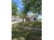 Charming single-story home boasts a manicured front yard and attached two-car garage, perfect for suburban living at 12910 Longcrest Dr, Riverview, FL 33579