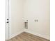 Laundry room with light-wood flooring and easy hookups for appliances at 12910 Longcrest Dr, Riverview, FL 33579