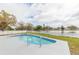 Beautiful backyard pool with a scenic lakeside view at 12910 Longcrest Dr, Riverview, FL 33579