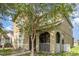 Two-story home featuring a lovely porch and well-maintained lawn at 13421 Lake Monroe Pl, Riverview, FL 33579
