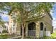 Two-story home featuring a lovely porch and well-maintained lawn at 13421 Lake Monroe Pl, Riverview, FL 33579