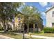 Charming two-story home featuring a lovely porch and well-maintained lawn at 13421 Lake Monroe Pl, Riverview, FL 33579