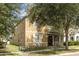 Charming home with front porch, black framed windows, and mature trees at 13421 Lake Monroe Pl, Riverview, FL 33579