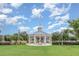 Central community gazebo features a flag pole, lovely landscaping and nearby green space for neighborhood gatherings at 13421 Lake Monroe Pl, Riverview, FL 33579