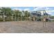 A community playground features swings and slides on a safety-mulched surface and surrounded by trees at 13421 Lake Monroe Pl, Riverview, FL 33579