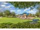 An inviting neighborhood playground offers slides and climbing areas surrounded by a lush lawn at 13421 Lake Monroe Pl, Riverview, FL 33579