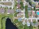 Aerial view of property in a neighborhood near a pond and winding streets at 13437 Beechberry Dr, Riverview, FL 33579