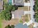 Aerial view of a single-Gathering home with a well-maintained roof and mature trees at 13437 Beechberry Dr, Riverview, FL 33579