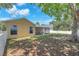Fenced backyard with screen enclosed patio, adjacent to large shade tree at 13437 Beechberry Dr, Riverview, FL 33579