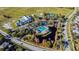 Aerial view showcases community pool, pond and clubhouse with ample parking at 13437 Beechberry Dr, Riverview, FL 33579