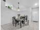 Bright dining room featuring tile floors, modern lighting, and room to entertain at 13437 Beechberry Dr, Riverview, FL 33579