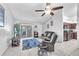 Open living room featuring tile floors and sliding glass doors to the back at 13437 Beechberry Dr, Riverview, FL 33579