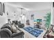 Comfortable living room with tile floors, ceiling fan, and cozy seating area at 13437 Beechberry Dr, Riverview, FL 33579