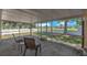 Screen enclosed patio with chairs features a peaceful outdoor space at 13437 Beechberry Dr, Riverview, FL 33579