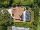 Overhead view of a property with a pool and solar panels on the roof at 13598 Park Blvd, Seminole, FL 33776