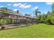 Expansive backyard with a screened pool and spa area, offering ample green space and privacy at 13598 Park Blvd, Seminole, FL 33776