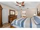 Comfortable bedroom with hardwood floors, tray ceiling and a wooden furniture set at 13598 Park Blvd, Seminole, FL 33776