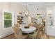Dining area with coastal decor, bright lighting, and seamless flow to living spaces at 13598 Park Blvd, Seminole, FL 33776