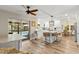 Modern kitchen with stainless steel appliances, a center island, and an adjacent dining area at 13598 Park Blvd, Seminole, FL 33776