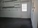Large basement with white door to outside and built-in shelving for extra storage space at 13725 Bermuda Dr, Seminole, FL 33776