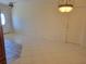 Bright dining room with tile floors, a front door with glass detail, and modern lighting at 13725 Bermuda Dr, Seminole, FL 33776