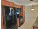 Spacious kitchen with stainless steel appliances, tile floors, and dark countertops at 13725 Bermuda Dr, Seminole, FL 33776
