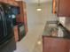 Spacious kitchen featuring stainless steel appliances and tile floors at 13725 Bermuda Dr, Seminole, FL 33776