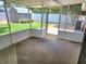Enclosed patio with view of shed and backyard, perfect for relaxing or entertaining outdoors at 13725 Bermuda Dr, Seminole, FL 33776