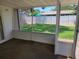 Enclosed patio showing view of the lawn, shed, and backyard at 13725 Bermuda Dr, Seminole, FL 33776
