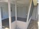 Enclosed patio featuring sliding doors and gray exterior at 13725 Bermuda Dr, Seminole, FL 33776
