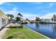 Waterfront backyard with a deck for relaxing, overlooking the tranquil canal and boat docks at 1382 52Nd Ne Ave, St Petersburg, FL 33703