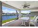 Outdoor patio with seating and grill, overlooking the canal at 1382 52Nd Ne Ave, St Petersburg, FL 33703