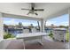 Covered outdoor deck with seating and a grill, showcasing stunning views of the canal at 1382 52Nd Ne Ave, St Petersburg, FL 33703