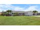 Charming single-story home with a well-manicured lawn and lush tropical landscaping at 1382 52Nd Ne Ave, St Petersburg, FL 33703