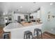 Bright and airy kitchen featuring modern appliances, white cabinetry and island with seating at 1382 52Nd Ne Ave, St Petersburg, FL 33703