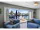 Inviting living room with doors that open to a canal, offering stunning water views at 1382 52Nd Ne Ave, St Petersburg, FL 33703