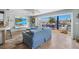 Cozy living room overlooking the canal-front deck with white chairs and a navy outdoor sofa at 1382 52Nd Ne Ave, St Petersburg, FL 33703