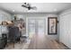 Home office with desk, chair, shelving, and waterfront views through sliding glass doors at 1382 52Nd Ne Ave, St Petersburg, FL 33703