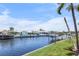 Beautiful waterfront view with private boat docks and lush landscaping along a scenic canal at 1382 52Nd Ne Ave, St Petersburg, FL 33703