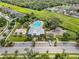Aerial view of community amenities with pool, playground, parking, and green spaces at 13912 Painted Bunting Ln, Riverview, FL 33579