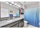 Elegant bathroom features double sinks, granite countertops, and stylish fixtures at 13912 Painted Bunting Ln, Riverview, FL 33579