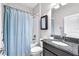 Cozy bathroom featuring a shower-tub combo and granite vanity at 13912 Painted Bunting Ln, Riverview, FL 33579