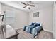Comfortable bedroom with ceiling fan, natural light, and cozy carpeting at 13912 Painted Bunting Ln, Riverview, FL 33579